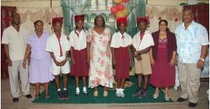 Top students of the St Aloysius Primary school with head teacher Holace Swears