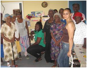 Donating care packages to senior citizens of the Good Samaritan Home in New Amsterdam recently as Project Director of the N/A International non-profit group