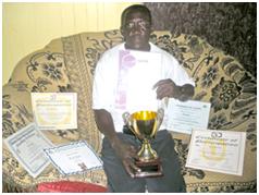 Posing with his fitness certificates and a trophy